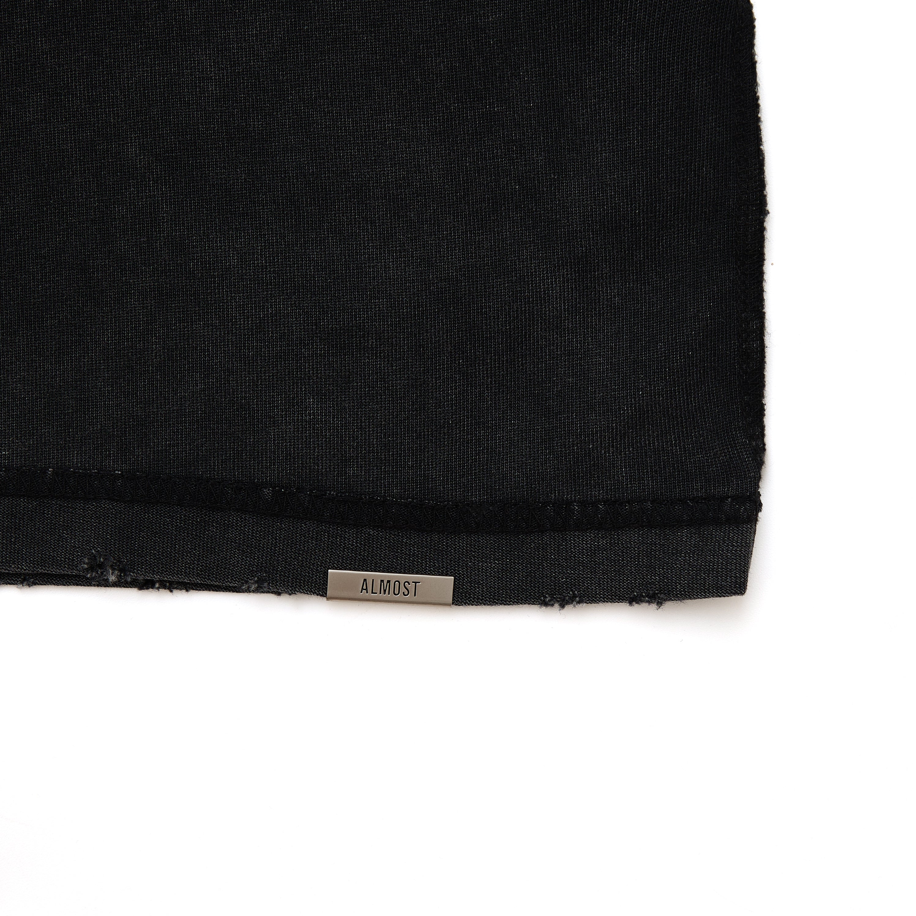 Black fabric with 'ALMOST' label on a white background