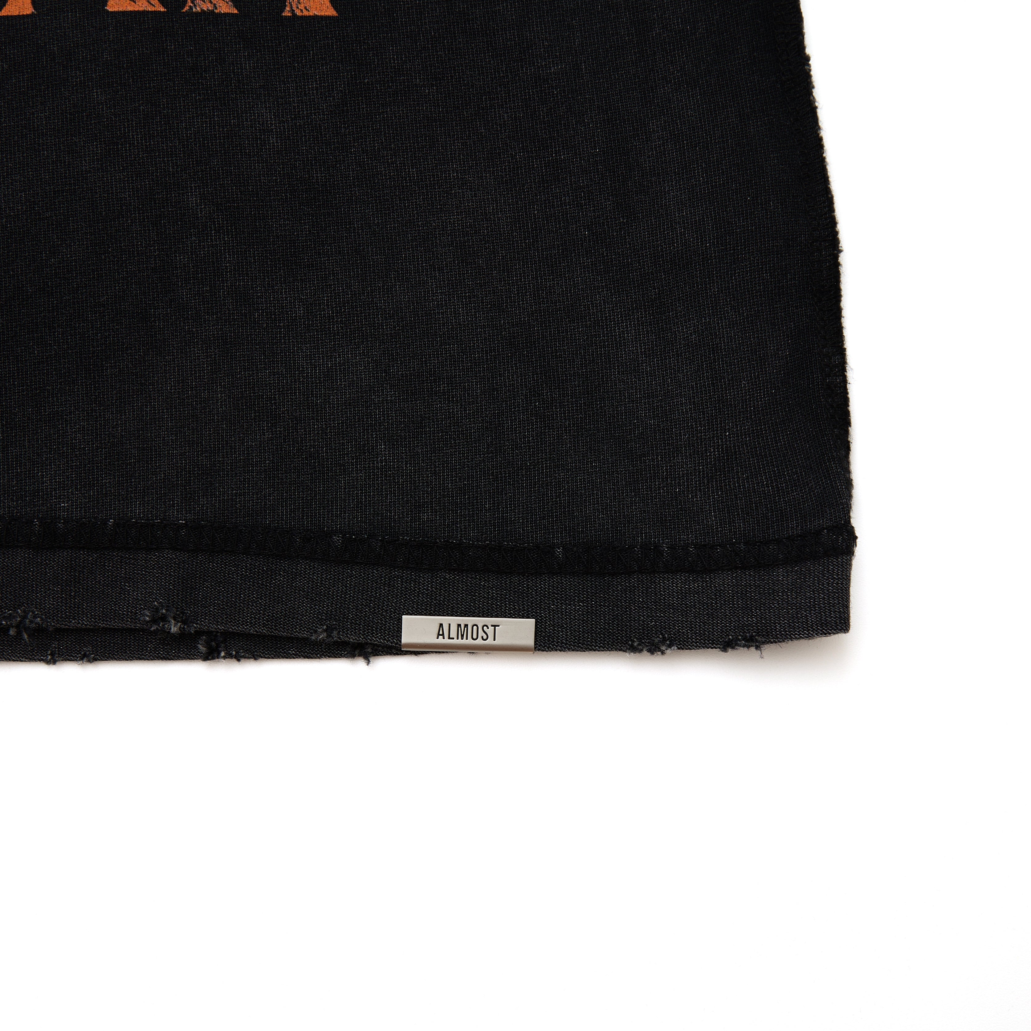 Black fabric with 'ALMOST' label on a white background