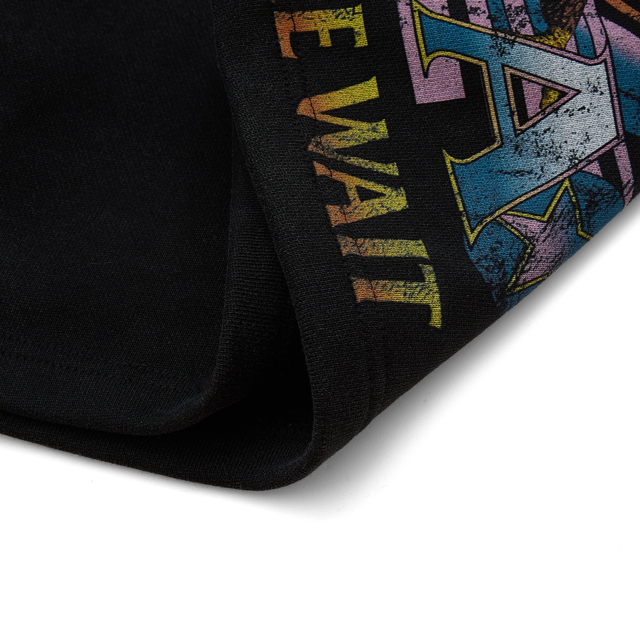 Black sweatshorts with colorful graphics on a white background