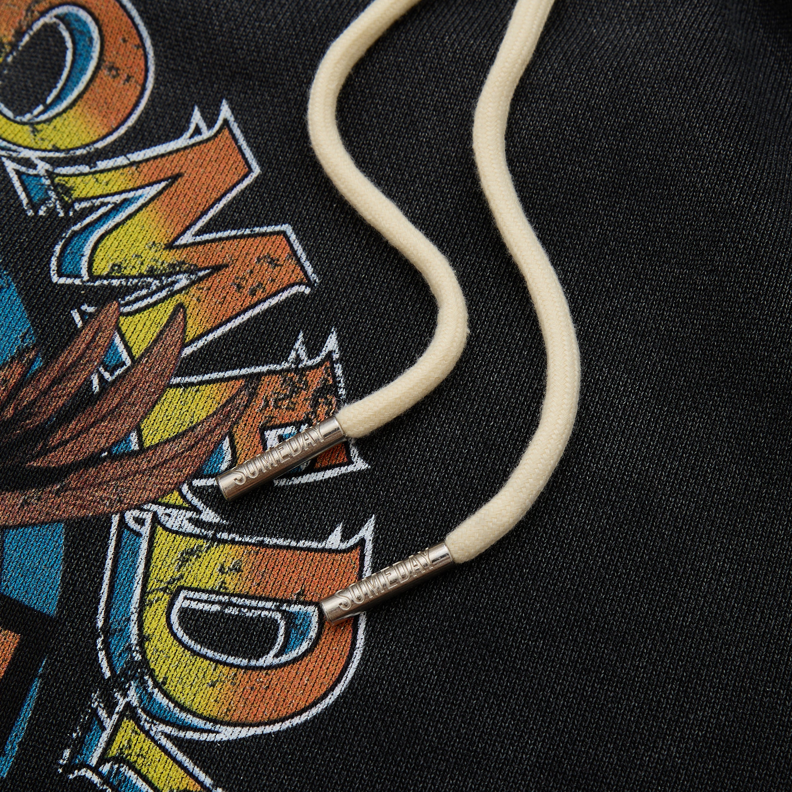 Close-up of a cord on a colorful graphic background