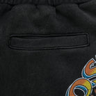 Close-up of a black sweatshirt with a colorful logo on the sleeve.