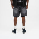 ALMOST SOMEDAY Letterman Denim Jort in Black, back view showing 5-pocket construction and subtle fade distressing