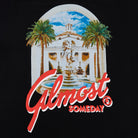 Logo with classical building, palm trees, and 'Almost Someday' text on a black background