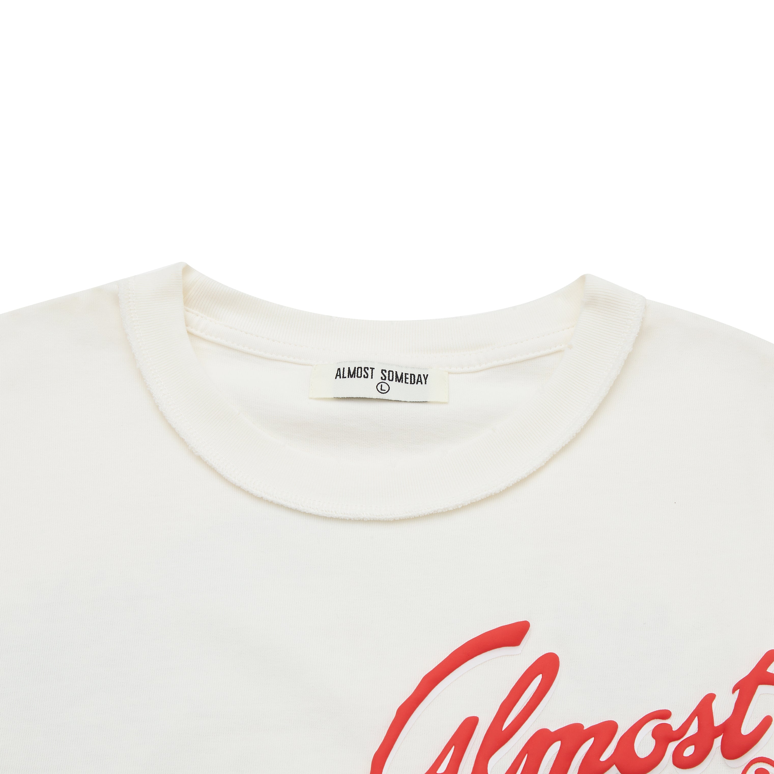 Cream t-shirt with red 'Almost' text and 'Almost Someday' label on a white background