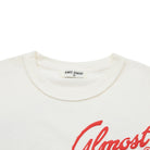 Cream t-shirt with red 'Almost' text and 'Almost Someday' label on a white background