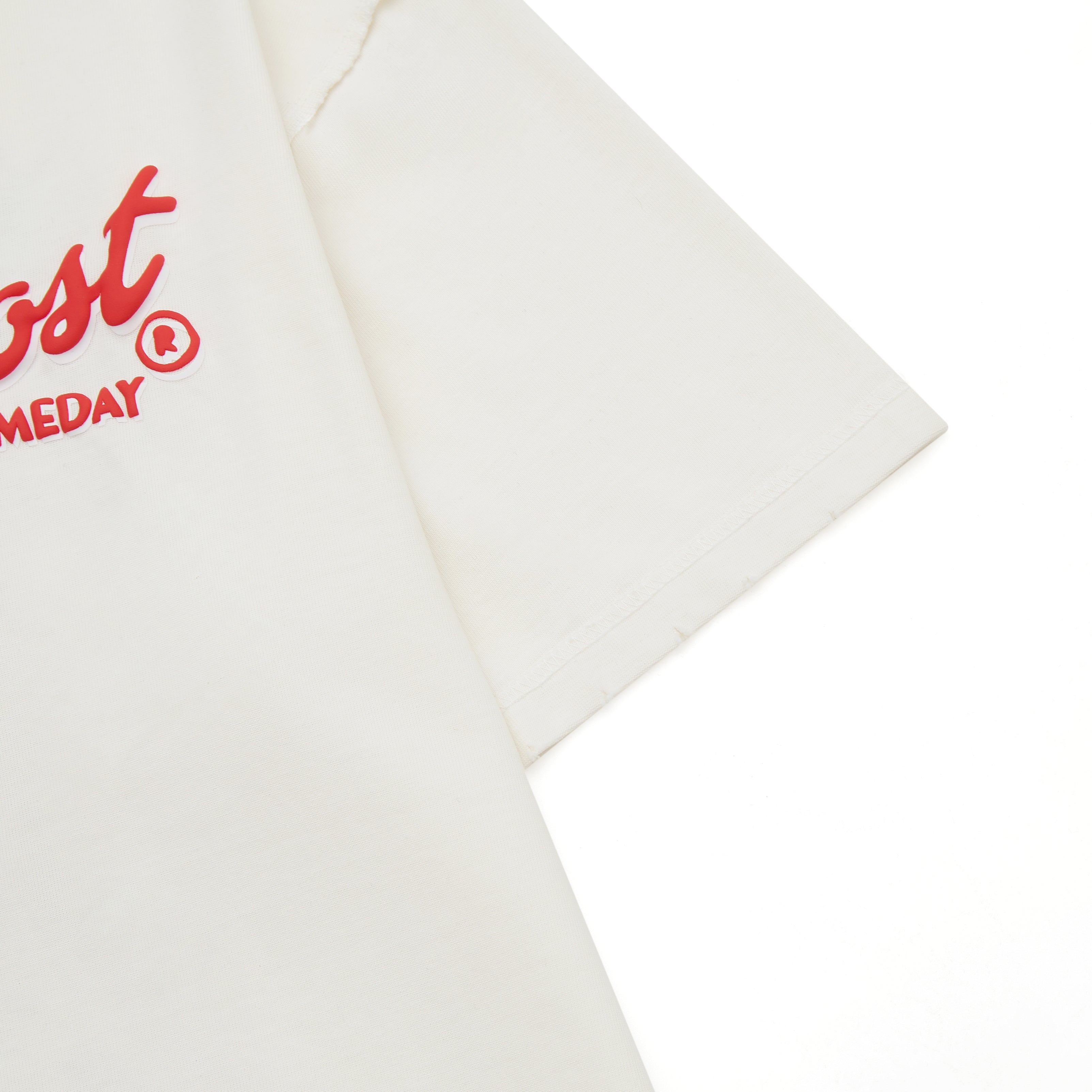 Cream t-shirt with red logo on a white background