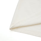 Close-up of cream fabric with a subtle texture on a white background