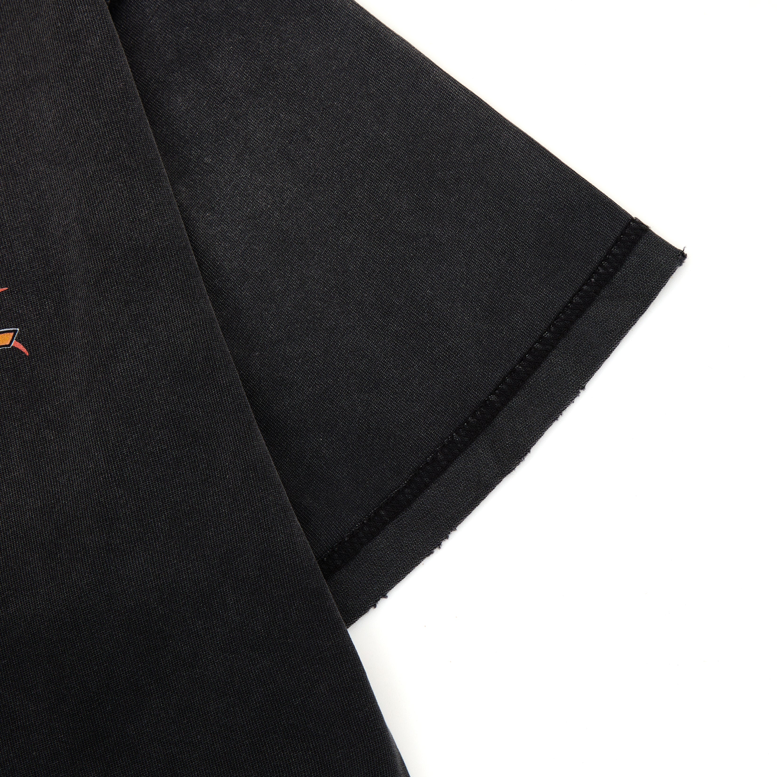Black fabric with a small orange logo on a white background