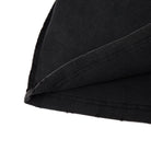 Close-up of black fabric with a white background