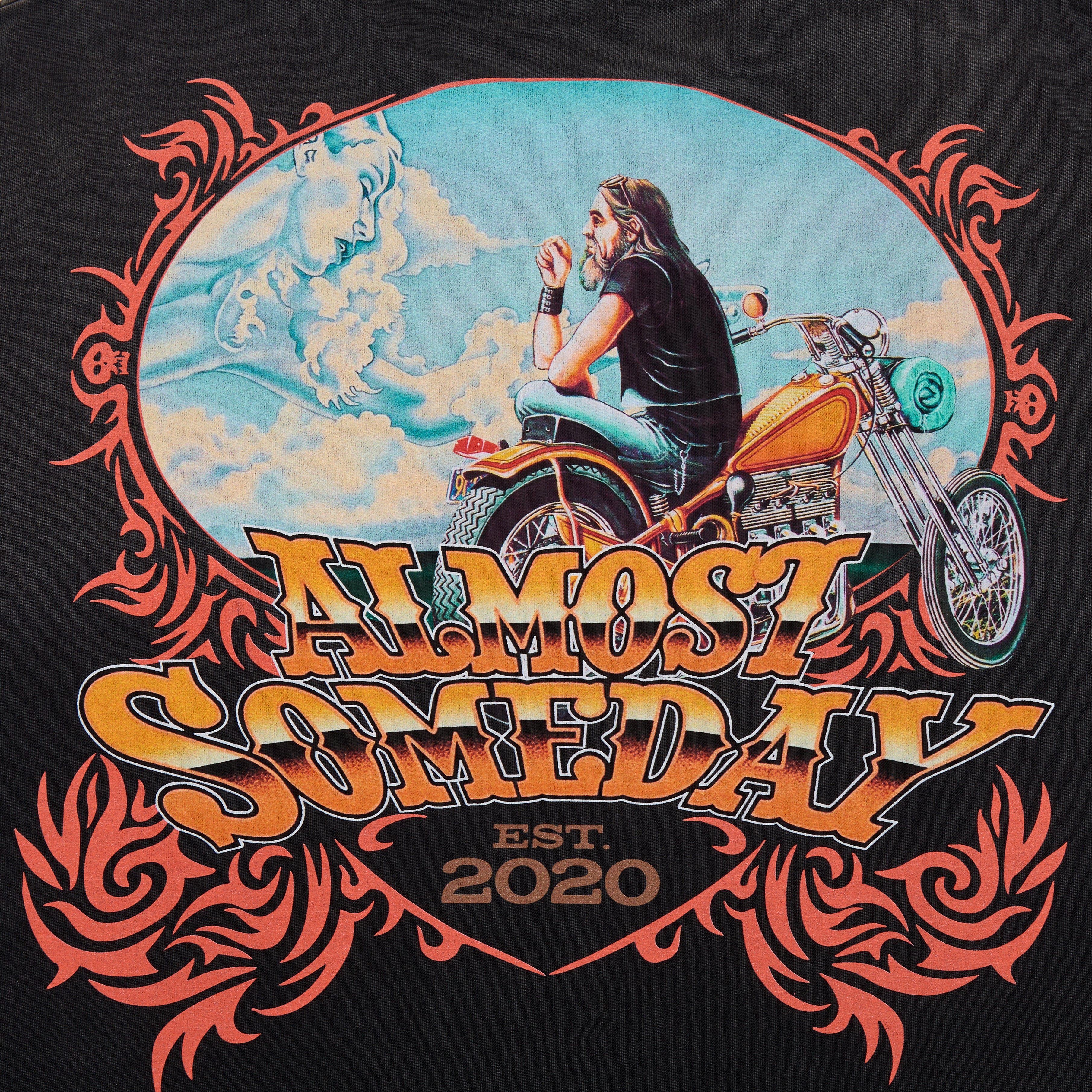 T-shirt design with a biker on a motorcycle and text 'Almost Someday Est. 2020' on a black background.
