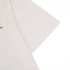 Close-up of a beige fabric with a subtle pattern on a white background
