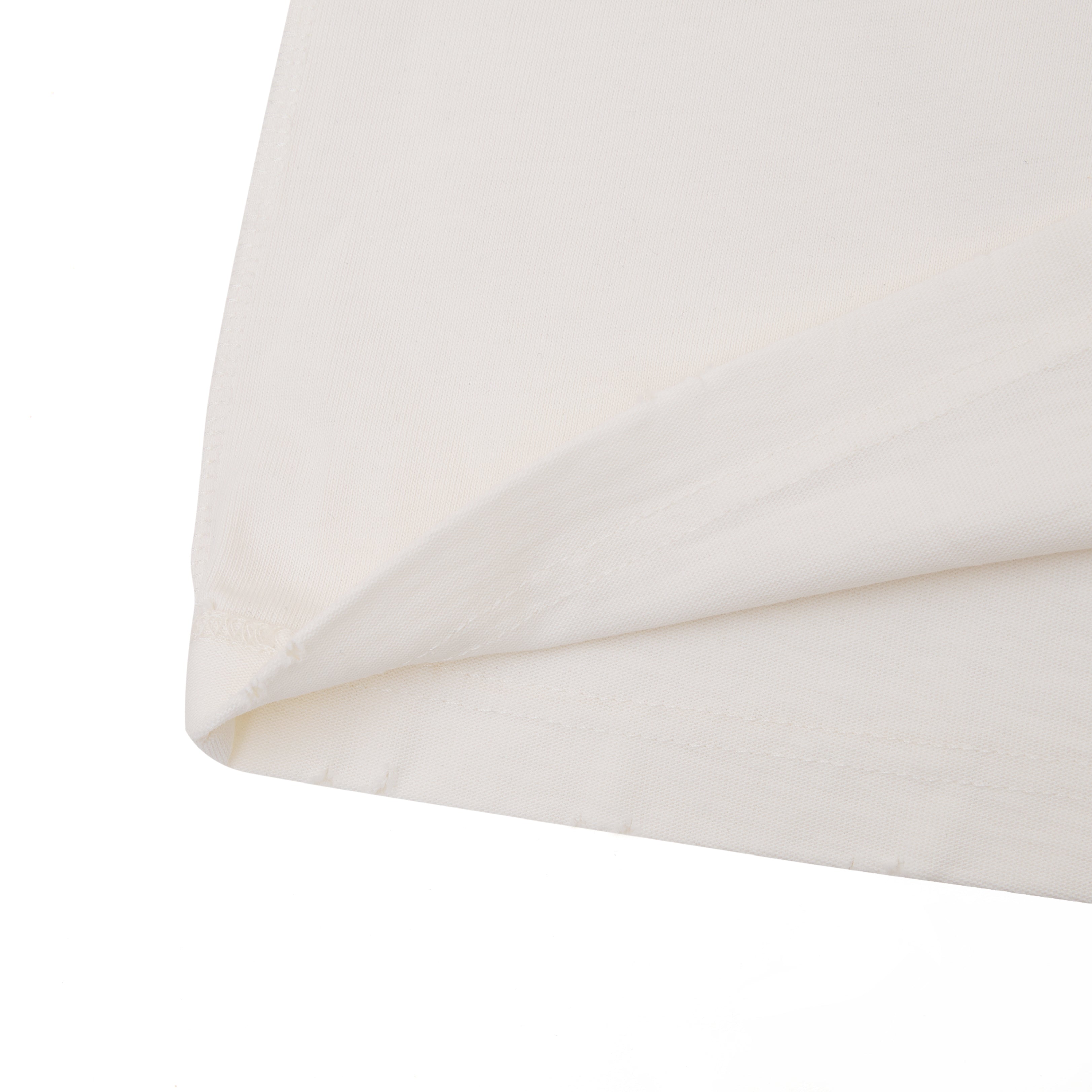 Close-up of a folded white fabric on a white background