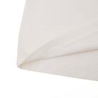 Close-up of a folded white fabric on a white background