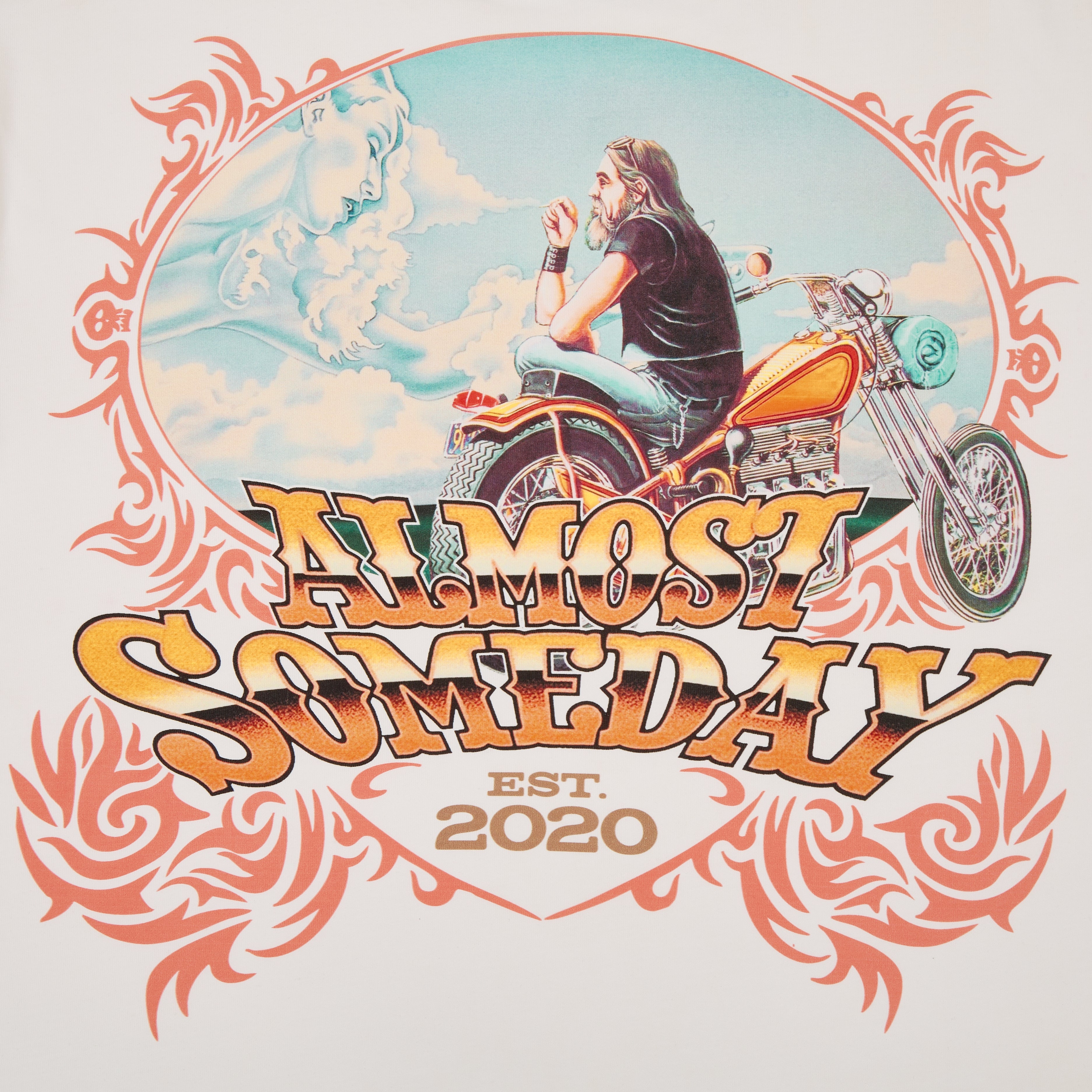 tshirt graphic with a person on a motorcycle and decorative text 'Almost Someday Est. 2020' against a scenic background.