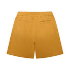 Mustard yellow shorts on a white background