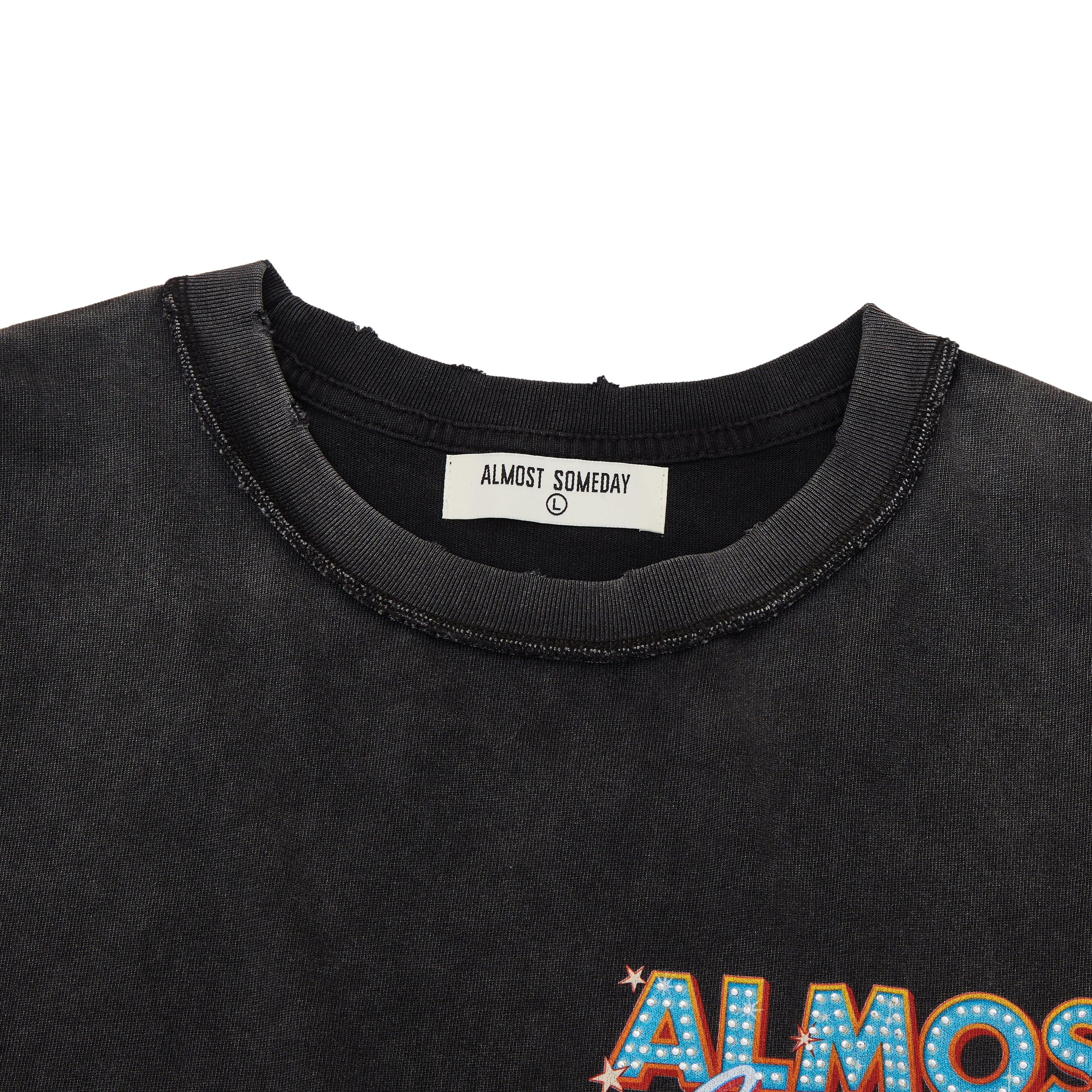 Black t-shirt with 'ALMOST SOMEDAY' text and brand label on a white background