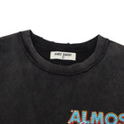 Black t-shirt with 'ALMOST SOMEDAY' text and brand label on a white background