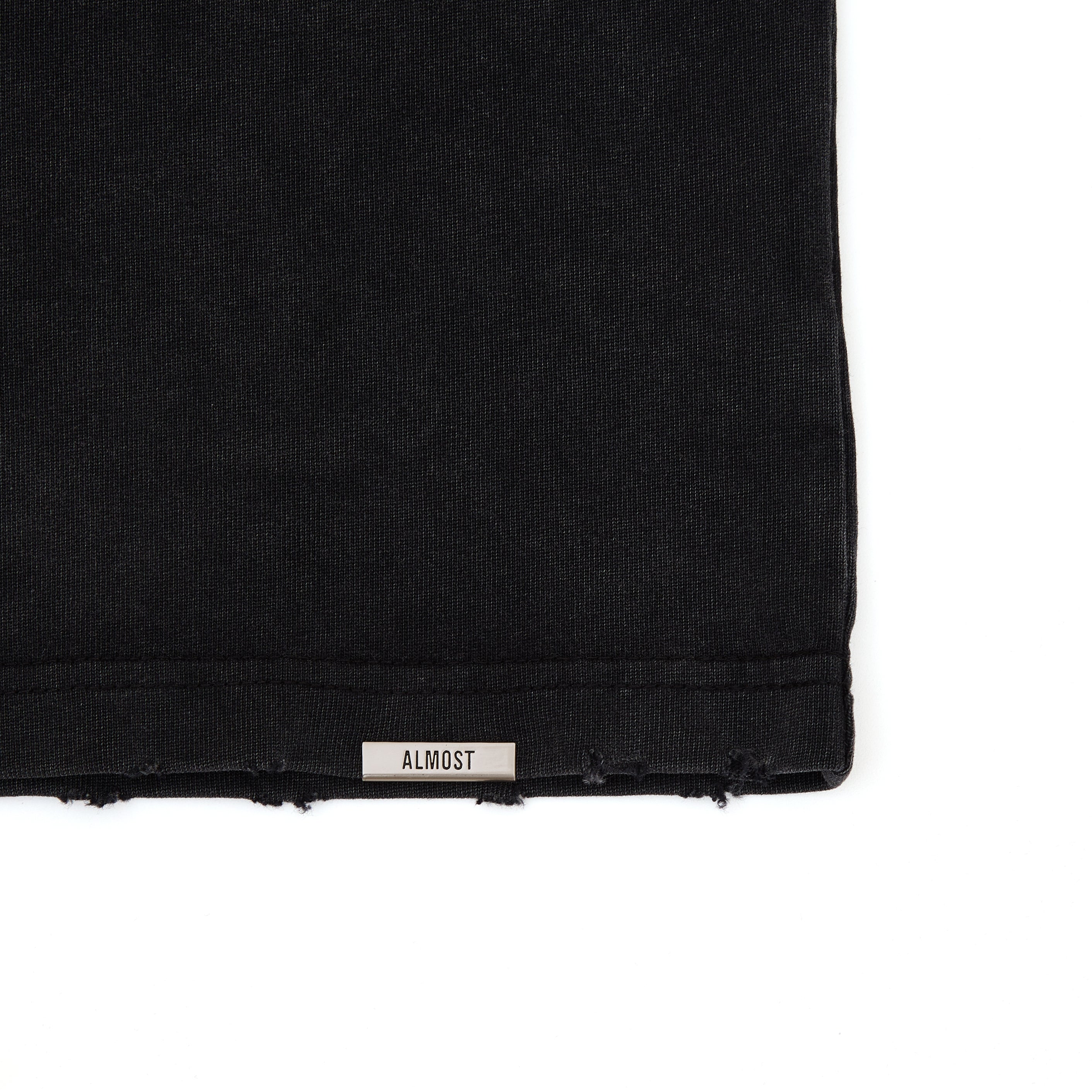 Black fabric with 'ALMOST' label on a white background