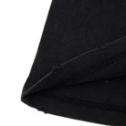 Close-up of black fabric with a white background