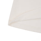 Close-up of a white lampshade on a white background