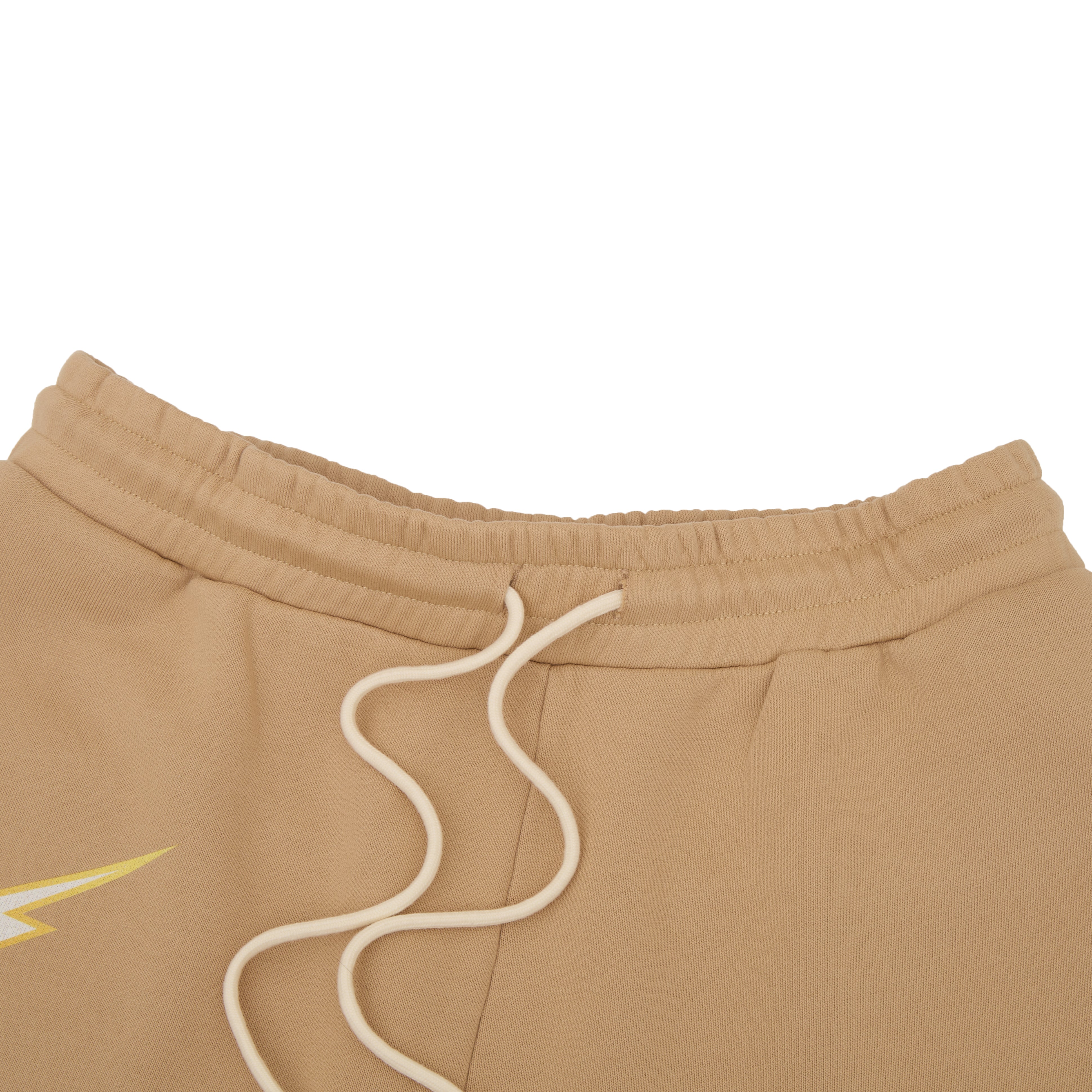 Close-up of beige sweatshorts with a drawstring on a white background
