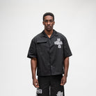 ALMOST SOMEDAY Vision Nylon Shirt in Black, front view with ornate cross graphic on right chest and utility pocket