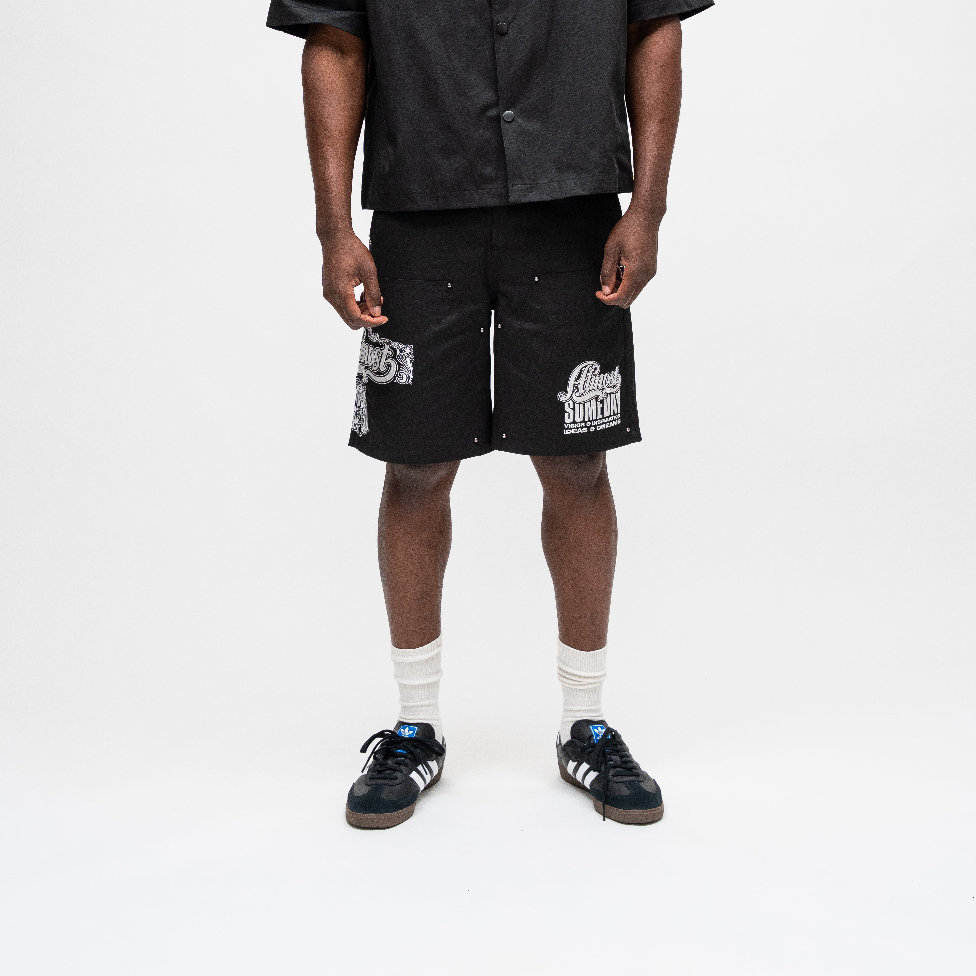 ALMOST SOMEDAY Vision Nylon Short in Black, front view with tiger graphic on left leg and script graphic on right leg