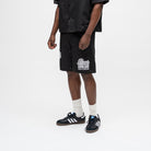 ALMOST SOMEDAY Vision Nylon Short in Black, lifestyle shot angled front view showing script graphic and snap side seam detail
