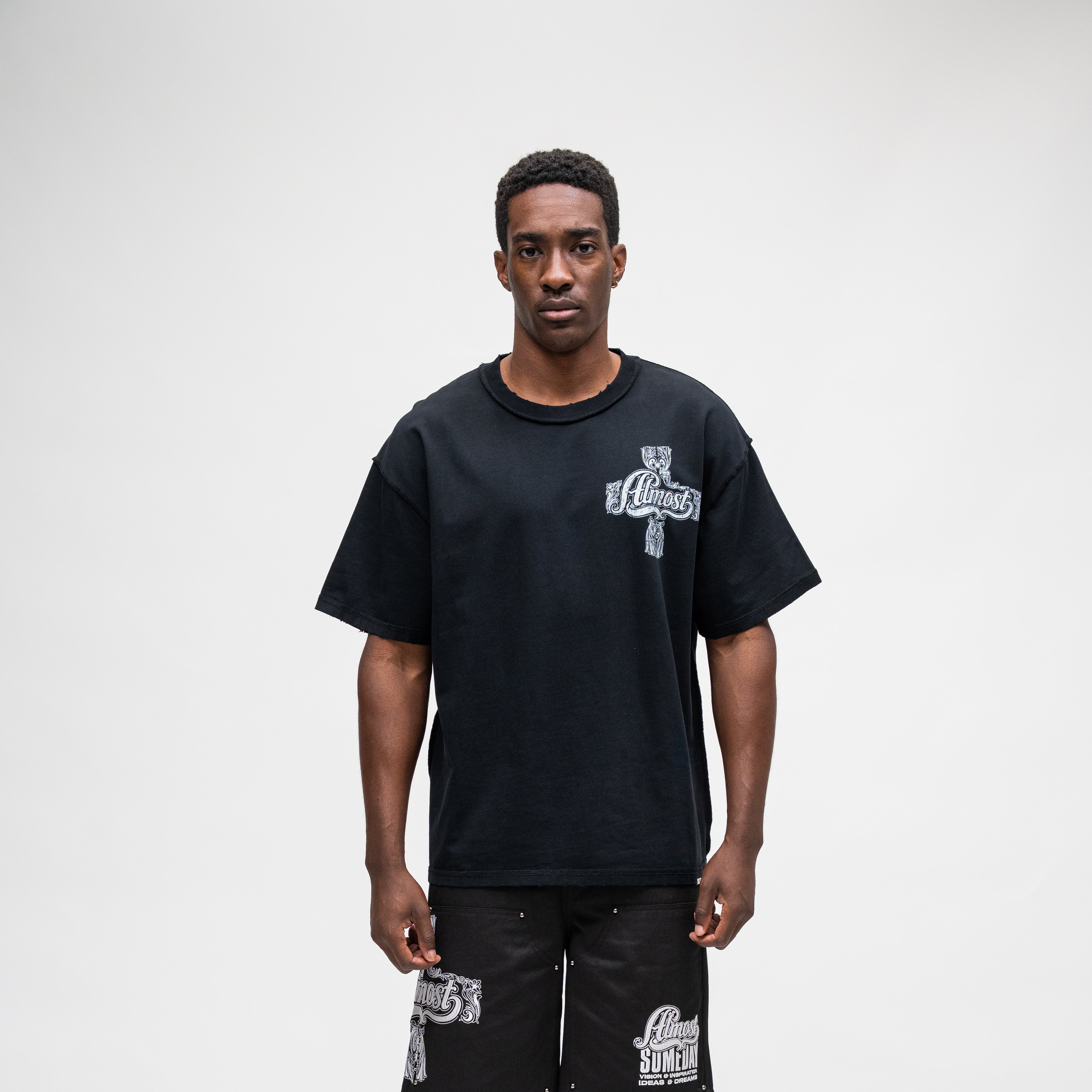 ALMOST SOMEDAY Vision Tee in Black, front view with ornate cross graphic on left chest
