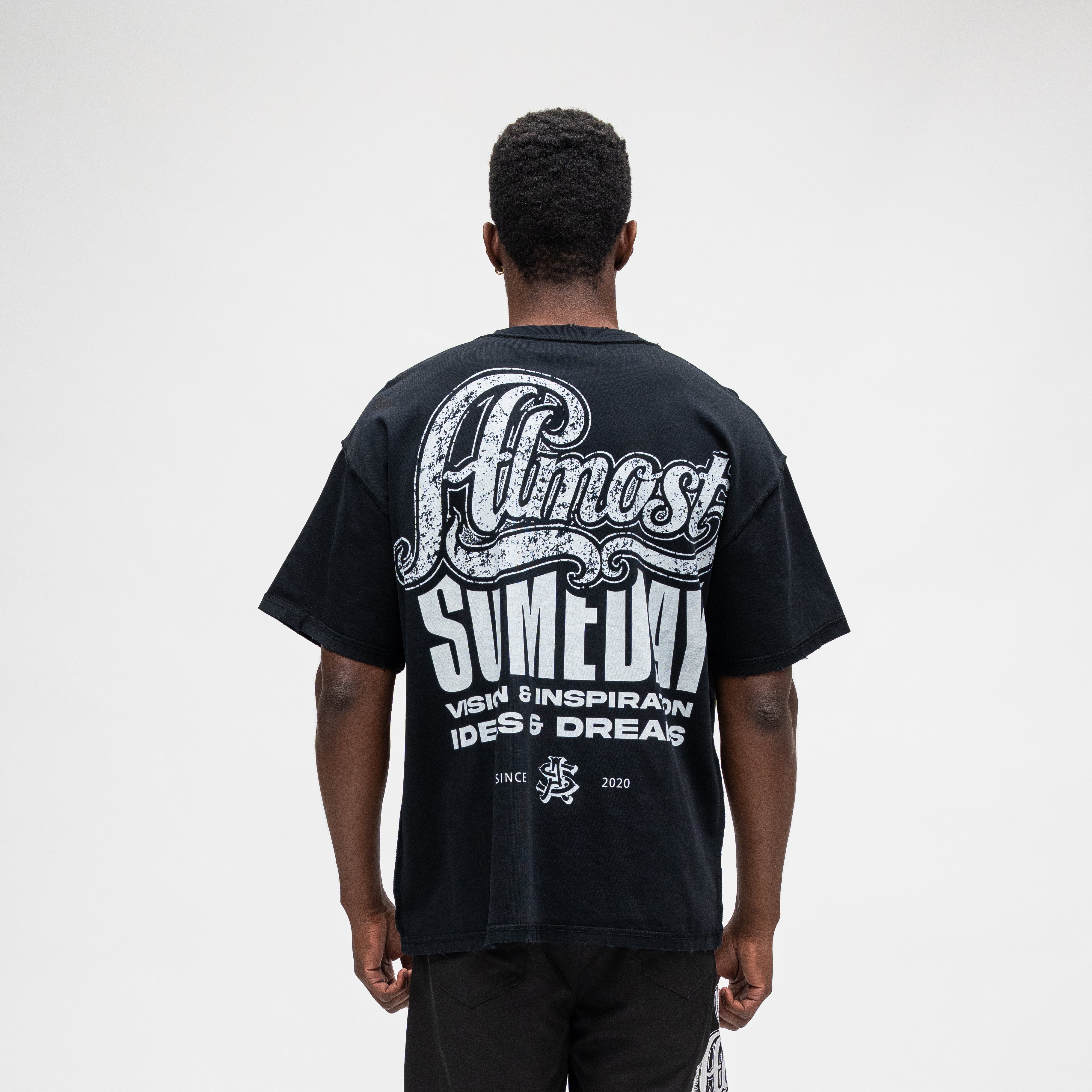 ALMOST SOMEDAY Vision Tee in Black, back view with full-back Almost Someday graphic print