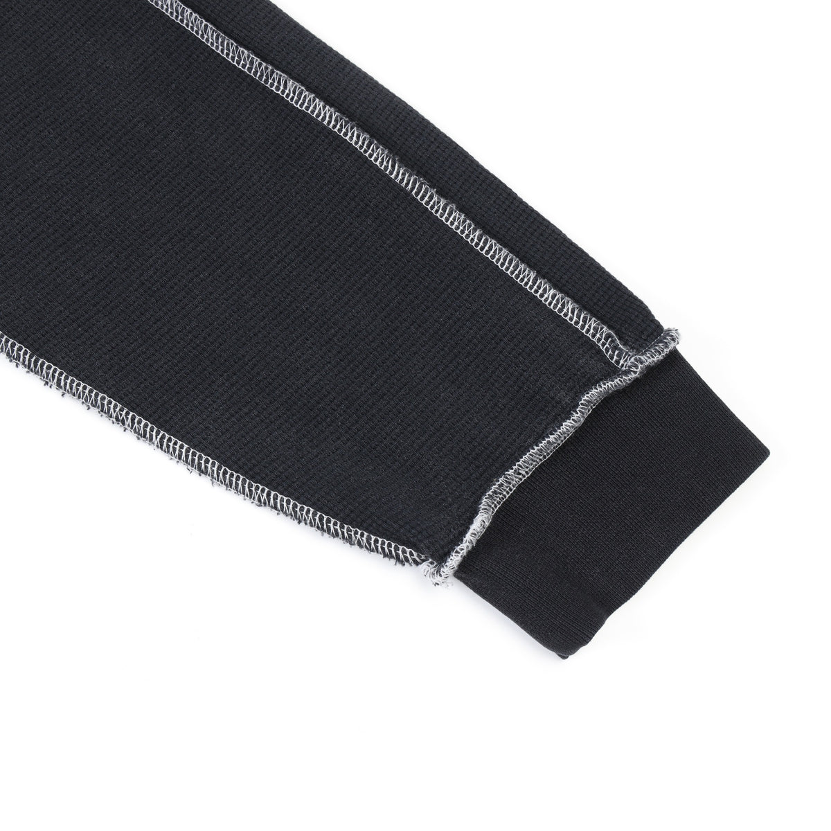 Alumni Crewneck – Black – Close-up of ribbed sleeve cuff and contrast-stitched sleeve panels