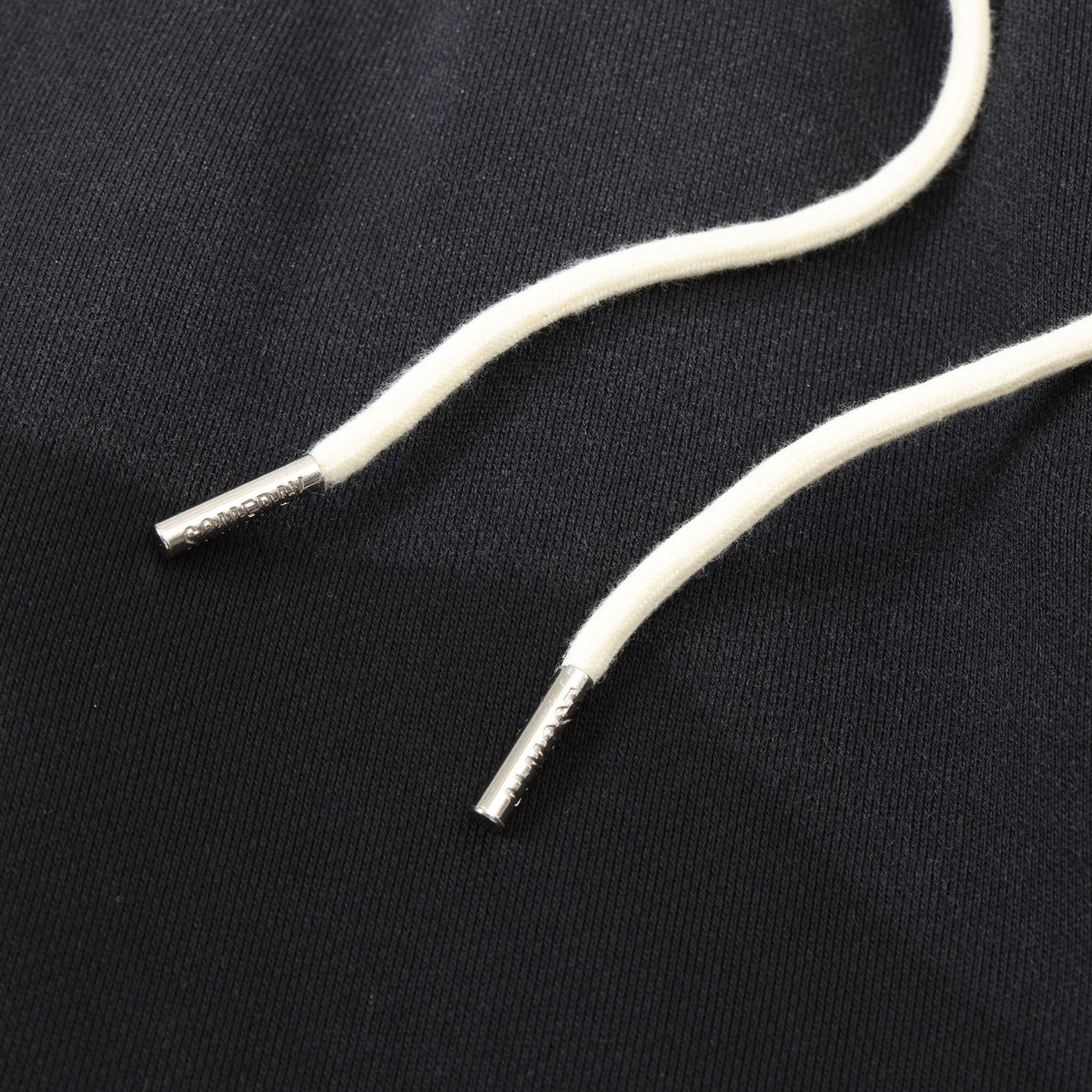 Enemies Flare Bottoms – Black – Close-up of white drawstrings with silver-tone metal tips