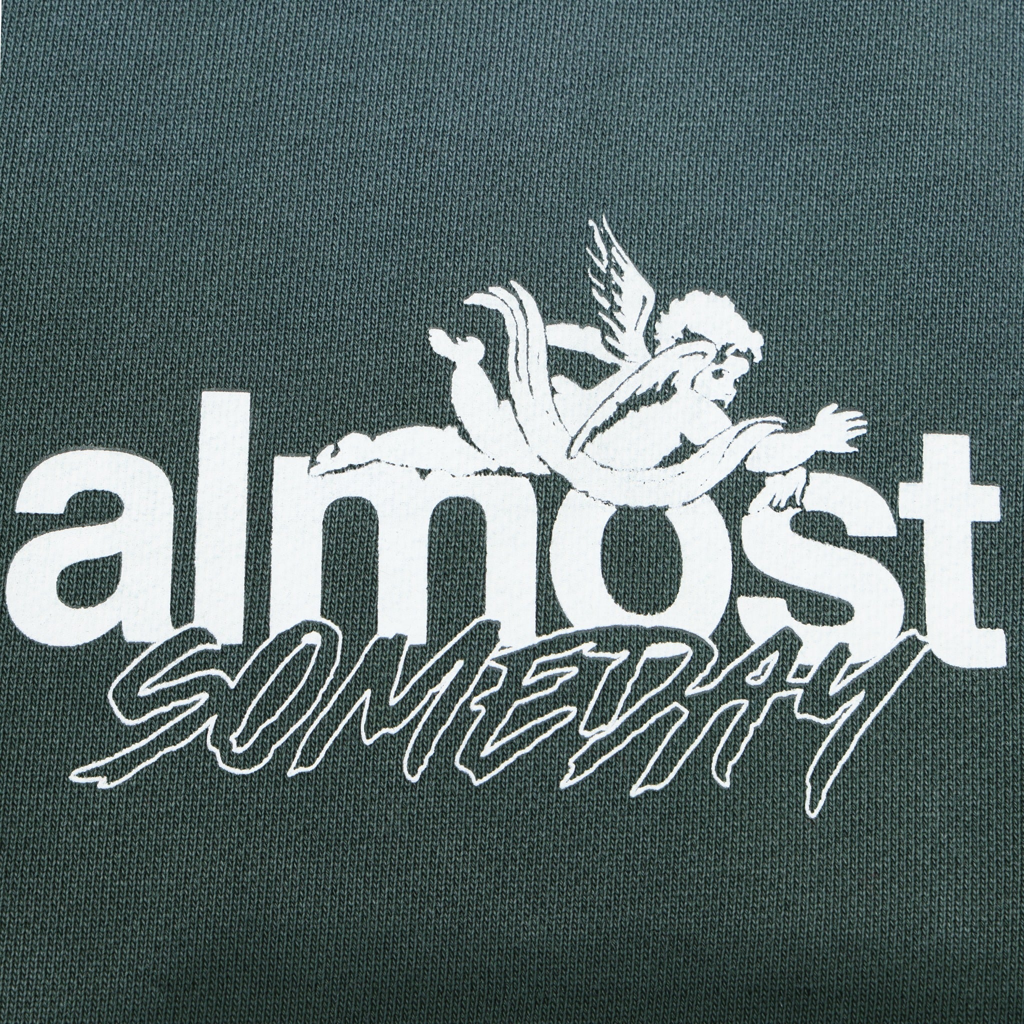 Enemies Flare Bottoms – Green – Close-up of white ALMOST SOMEDAY lettering and winged figure logo