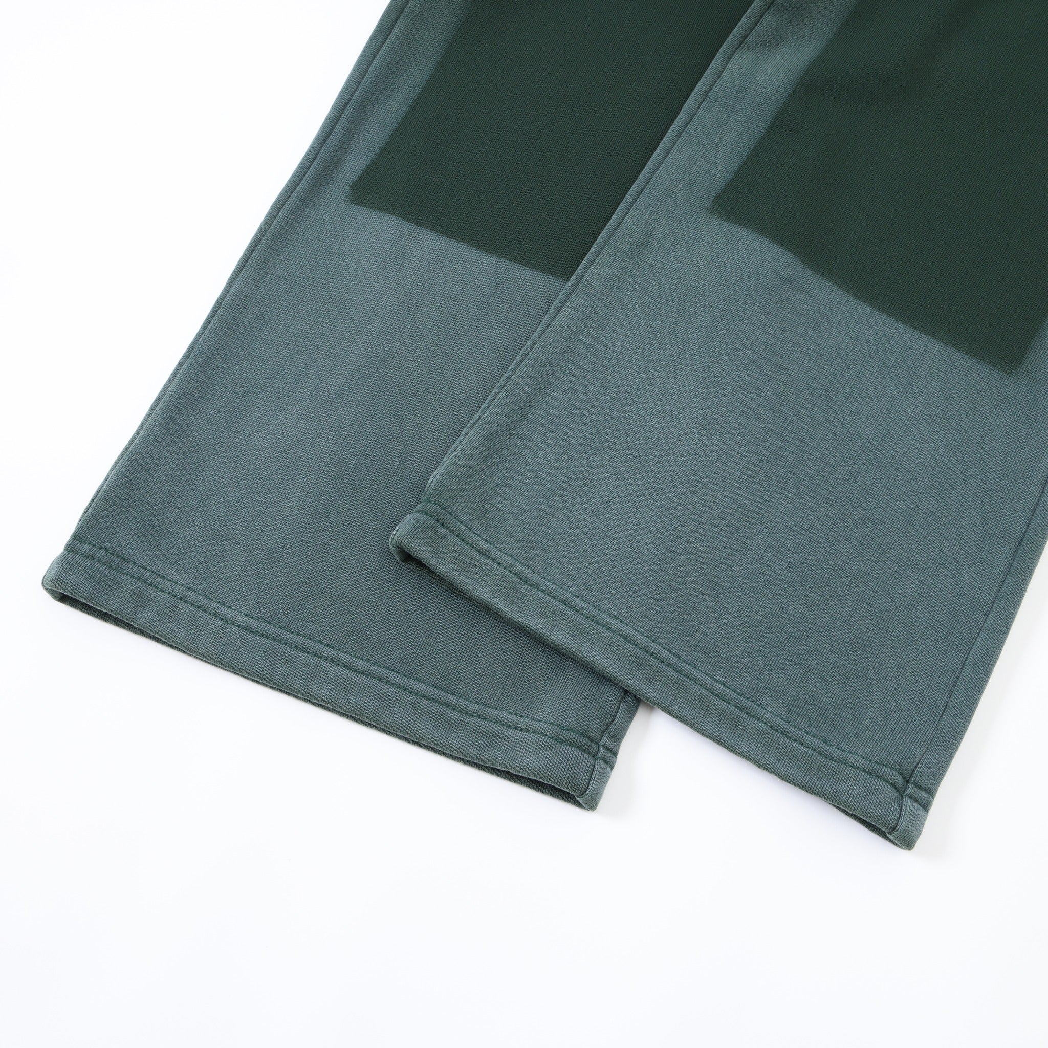 Enemies Flare Bottoms – Green – Close-up of stitched open hems and dark tonal leg panels