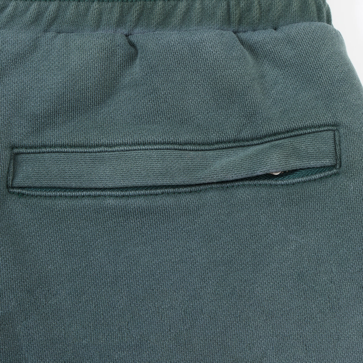 Enemies Flare Bottoms – Green – Close-up of rear welt pocket with concealed zip closure
