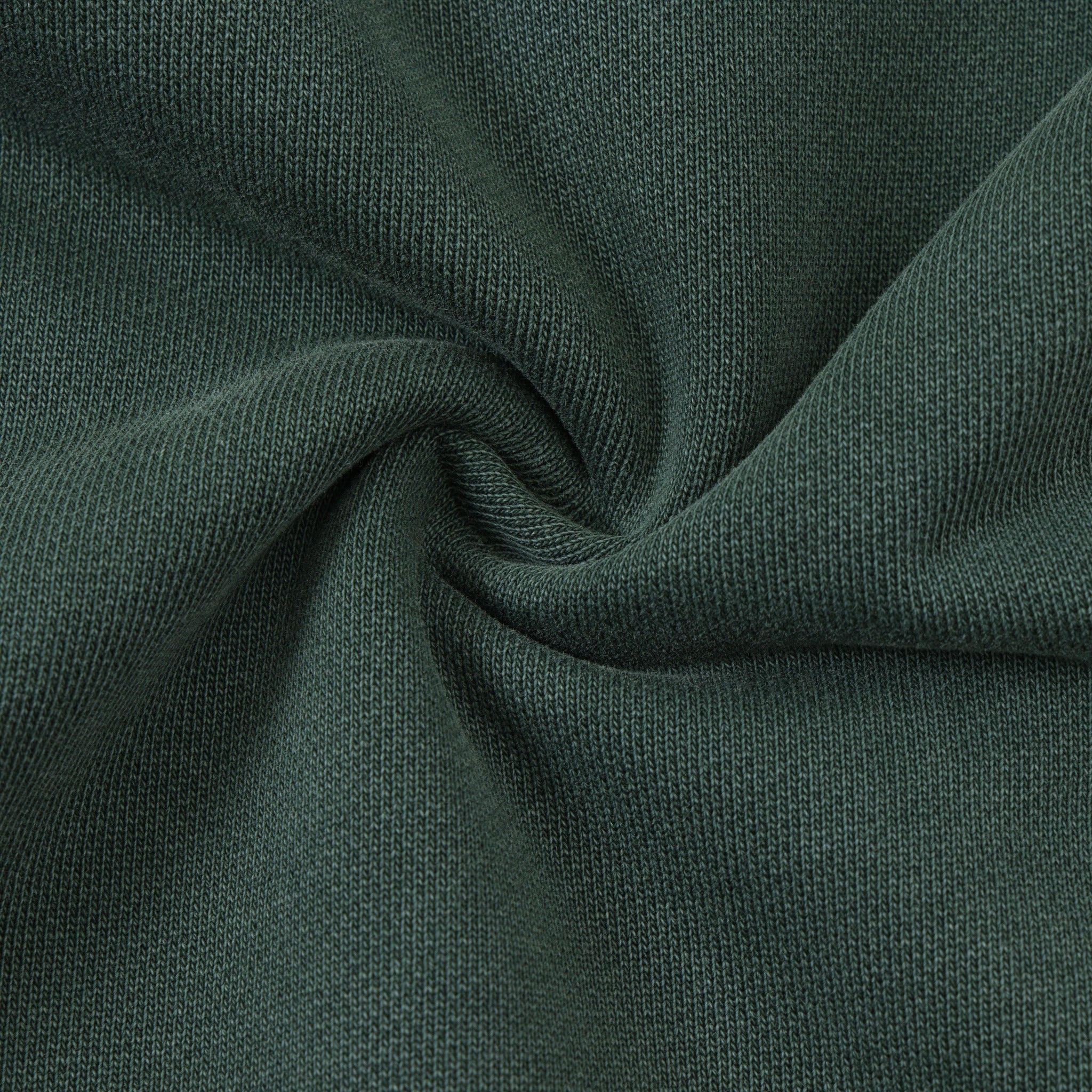 Enemies Flare Bottoms – Green – Close-up of green fabric gathered to show knit texture