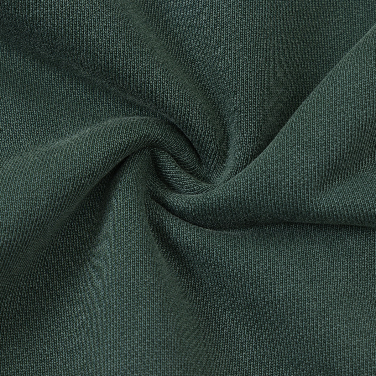Enemies Flare Bottoms – Green – Close-up of green fabric gathered to show knit texture