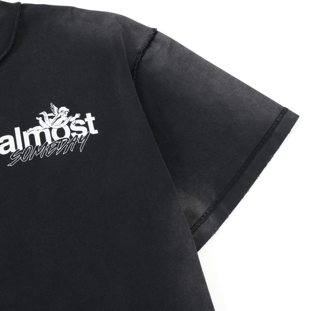 Enemies Tee – Black – Close-up of chest logo, shoulder seam, and sleeve stitching
