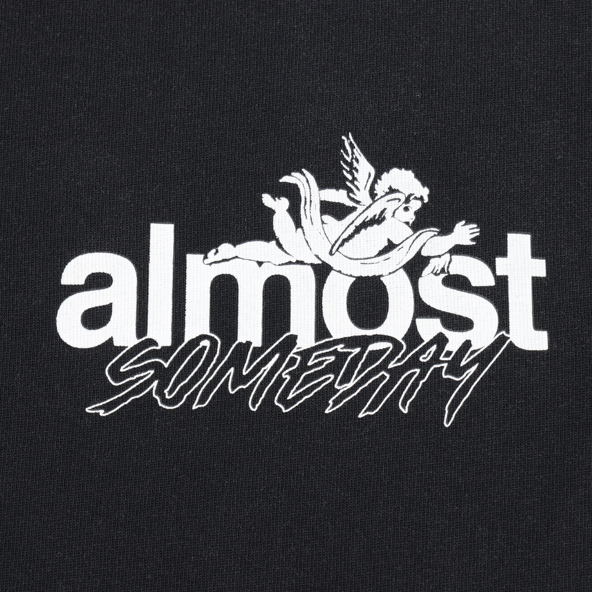 Enemies Tee – Black – Close-up of white ALMOST SOMEDAY chest lettering and winged figure logo