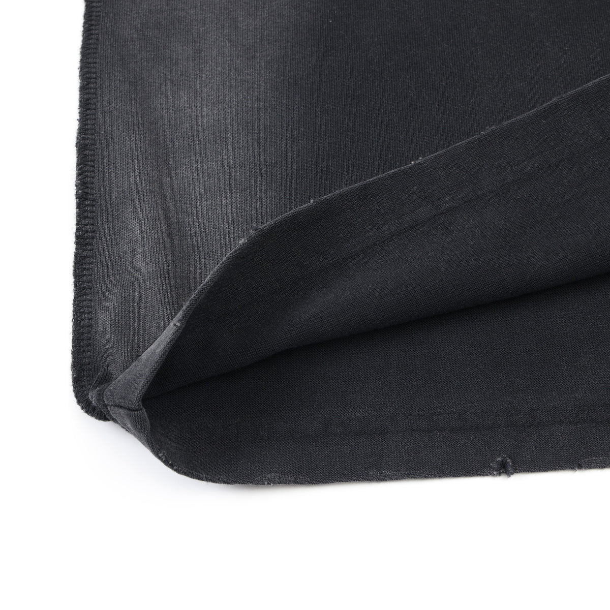 Enemies Tee – Black – Close-up of turned-up bottom hem and fabric underside