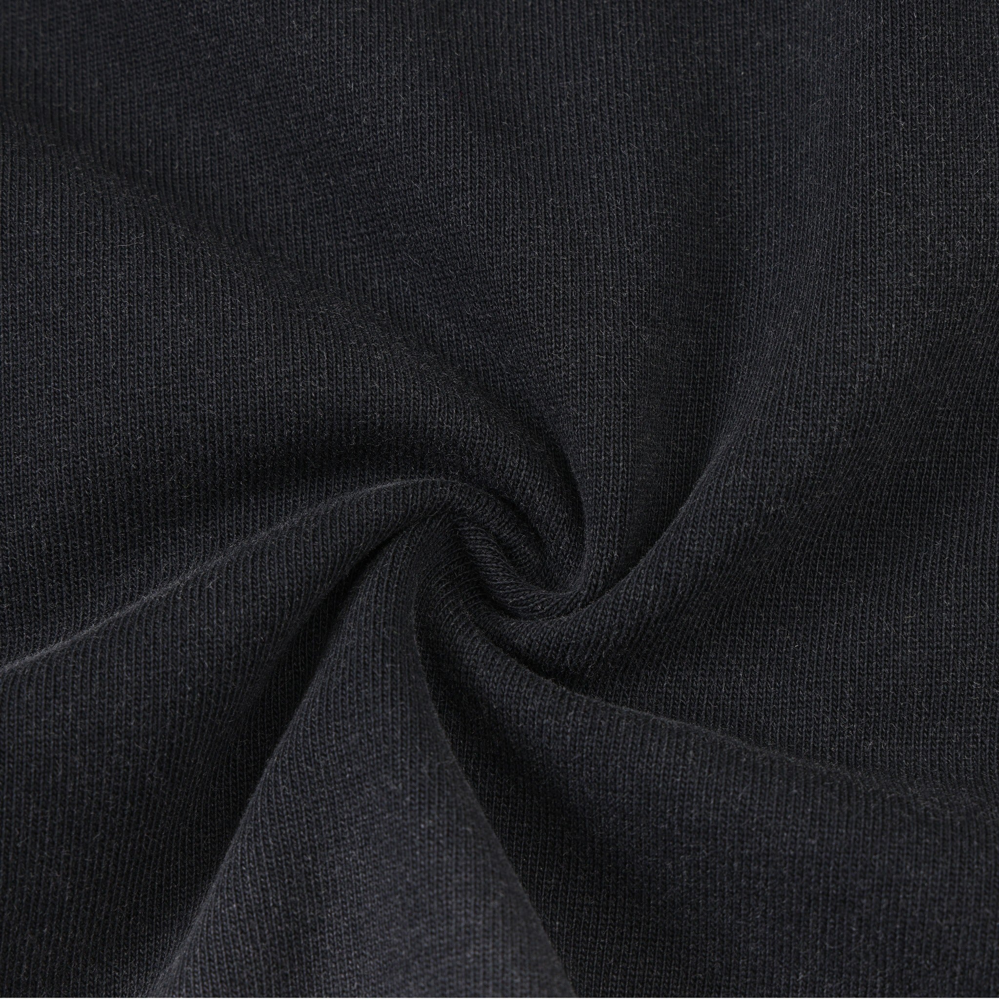 Enemies Tee – Black – Close-up of black fabric gathered to show knit texture
