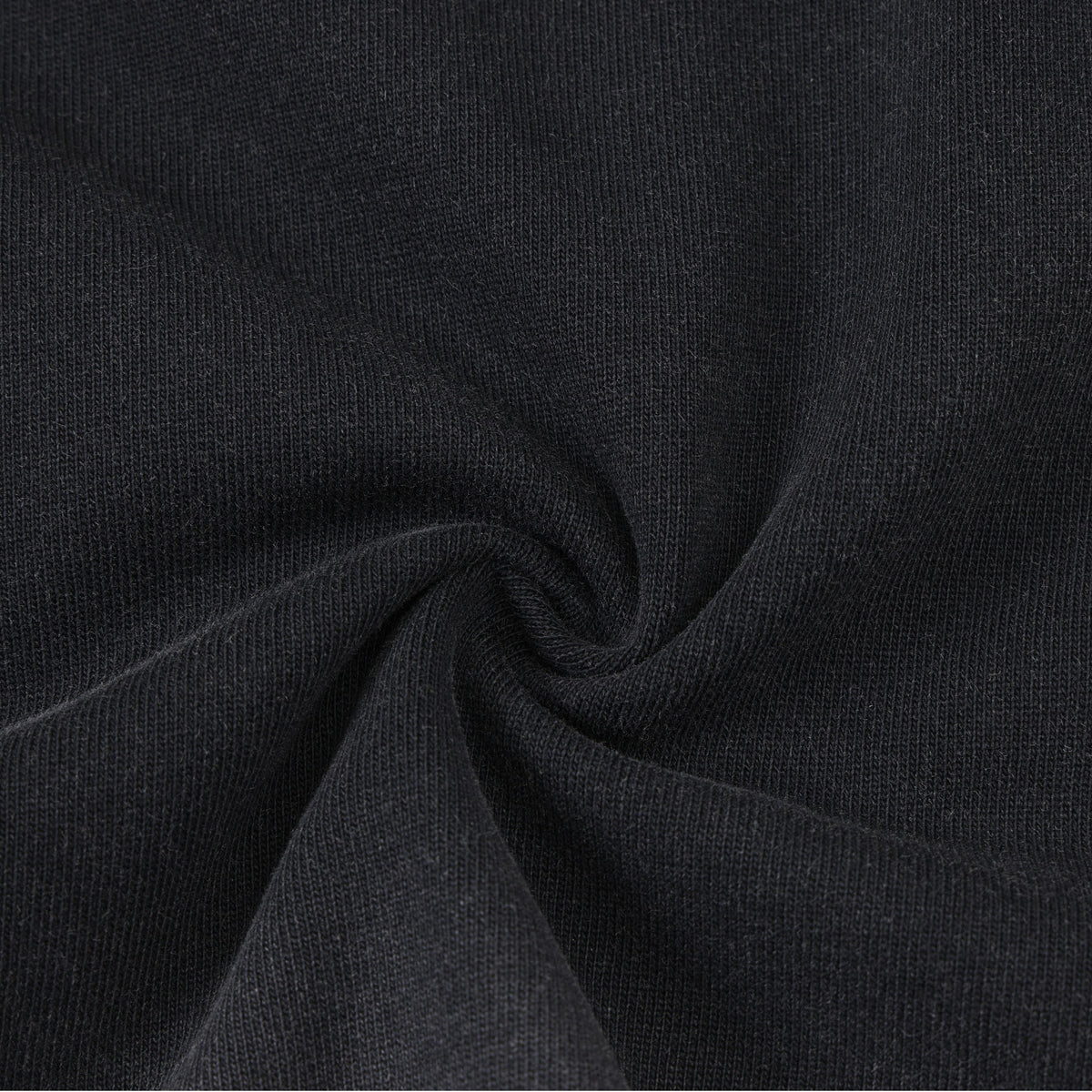 Enemies Tee – Black – Close-up of black fabric gathered to show knit texture