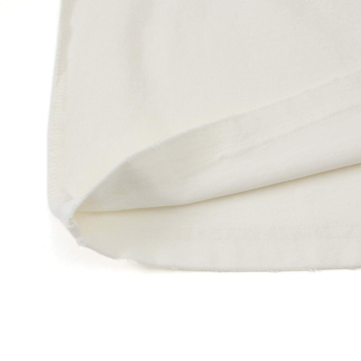 Enemies Tee – Cream – Close-up of turned-up bottom hem and fabric underside