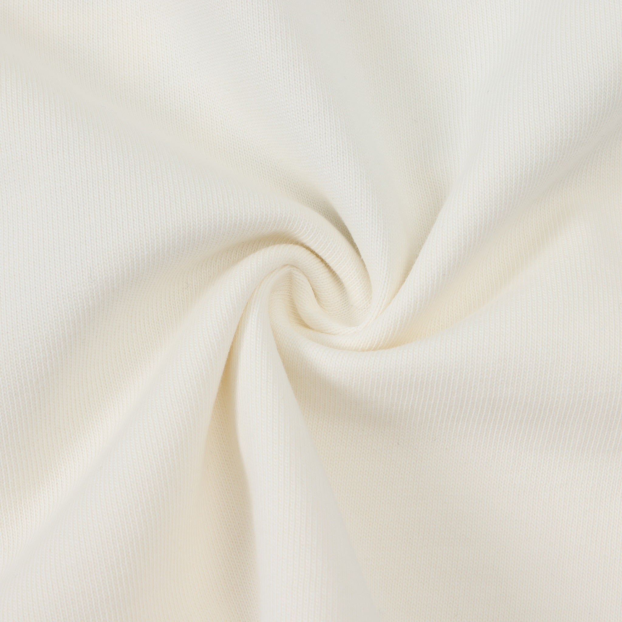 Enemies Tee – Cream – Close-up of cream fabric gathered to show knit texture