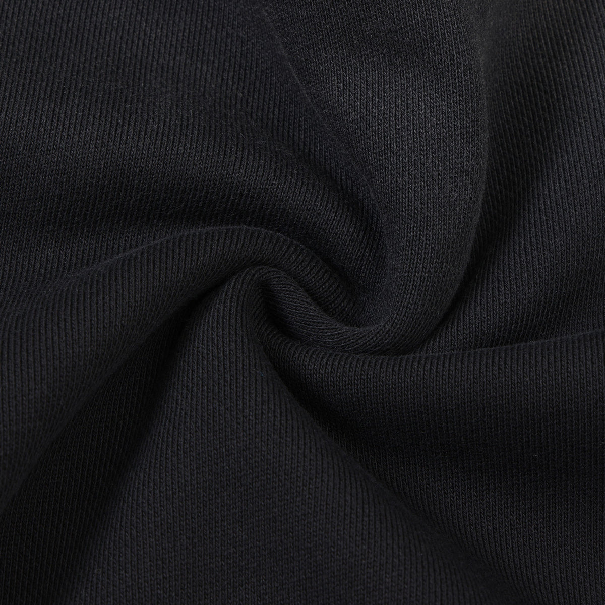 Enemies Zip Hoodie – Black – Close-up of black fabric gathered to show knit texture