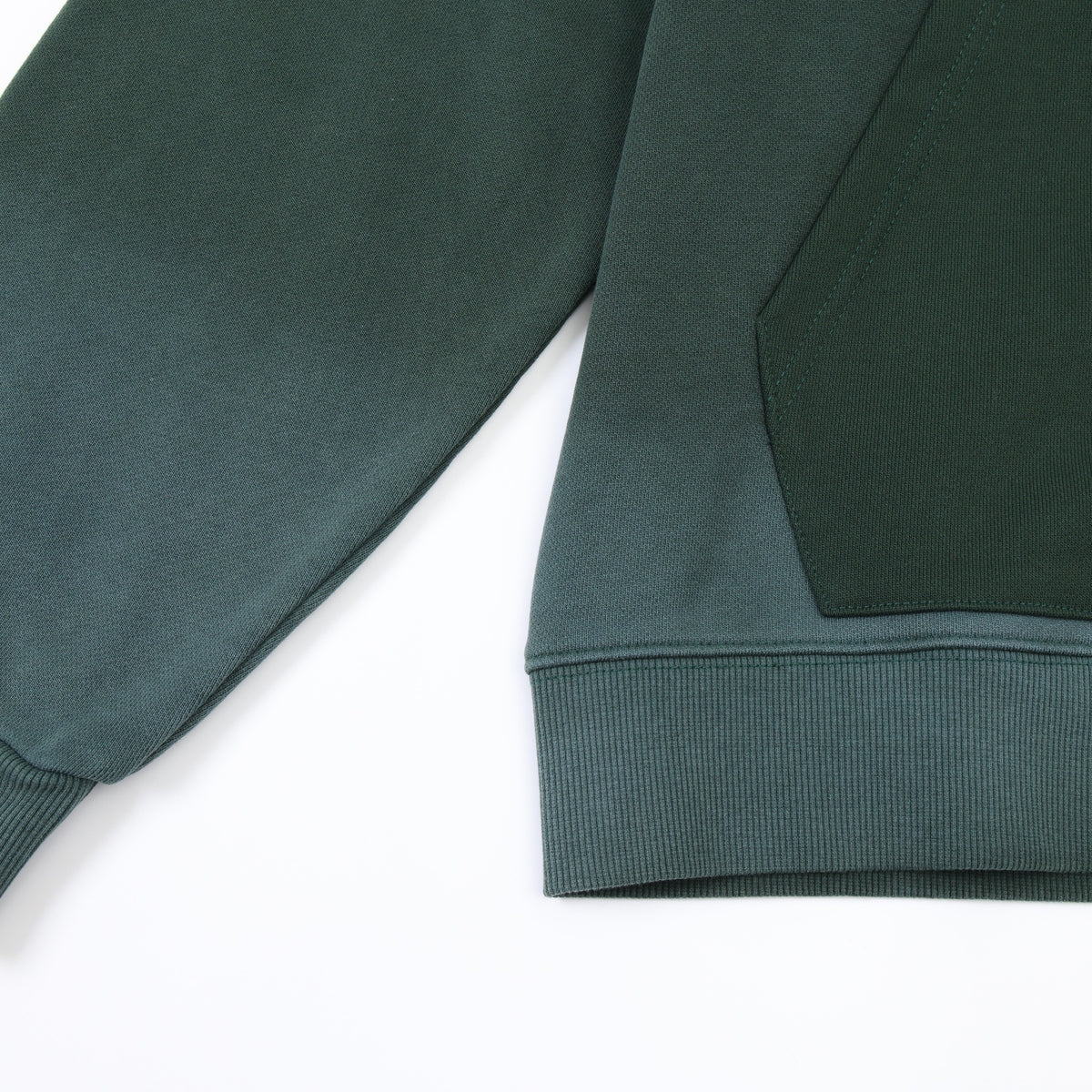 Enemies Zip Hoodie – Green – Close-up of contrasting front pocket, ribbed bottom hem, and sleeve