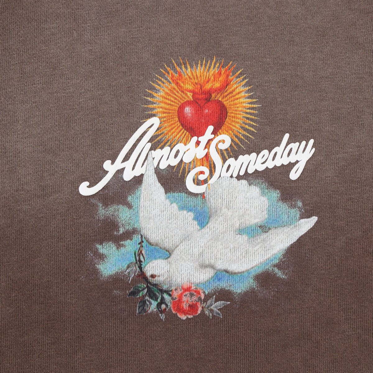 Fountain Hoodie – Brown – Close-up of chest graphic with flaming red heart, white dove, flowers, and Almost Someday script