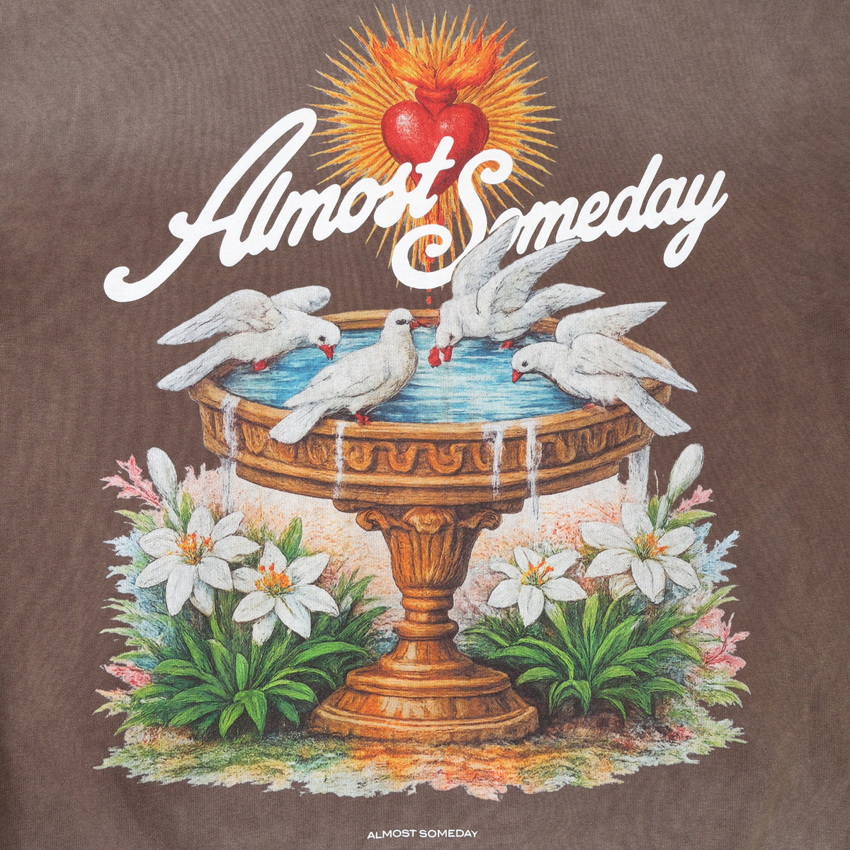 Fountain Hoodie – Brown – Close-up of back artwork featuring golden fountain, white doves, flowers, flaming heart, and script branding