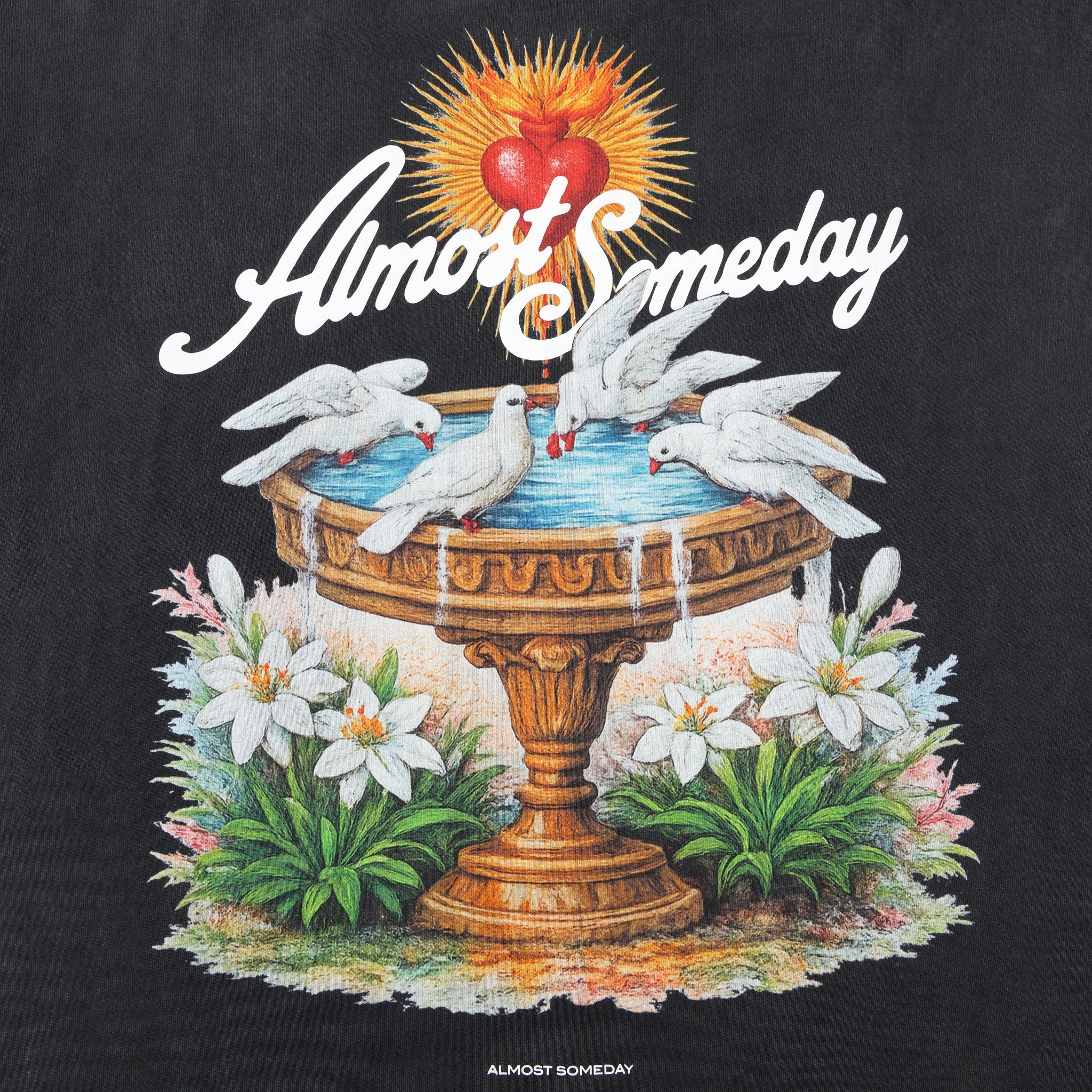 Fountain Tee – Black – Close-up of back artwork with golden fountain, white doves, flowers, and red heart