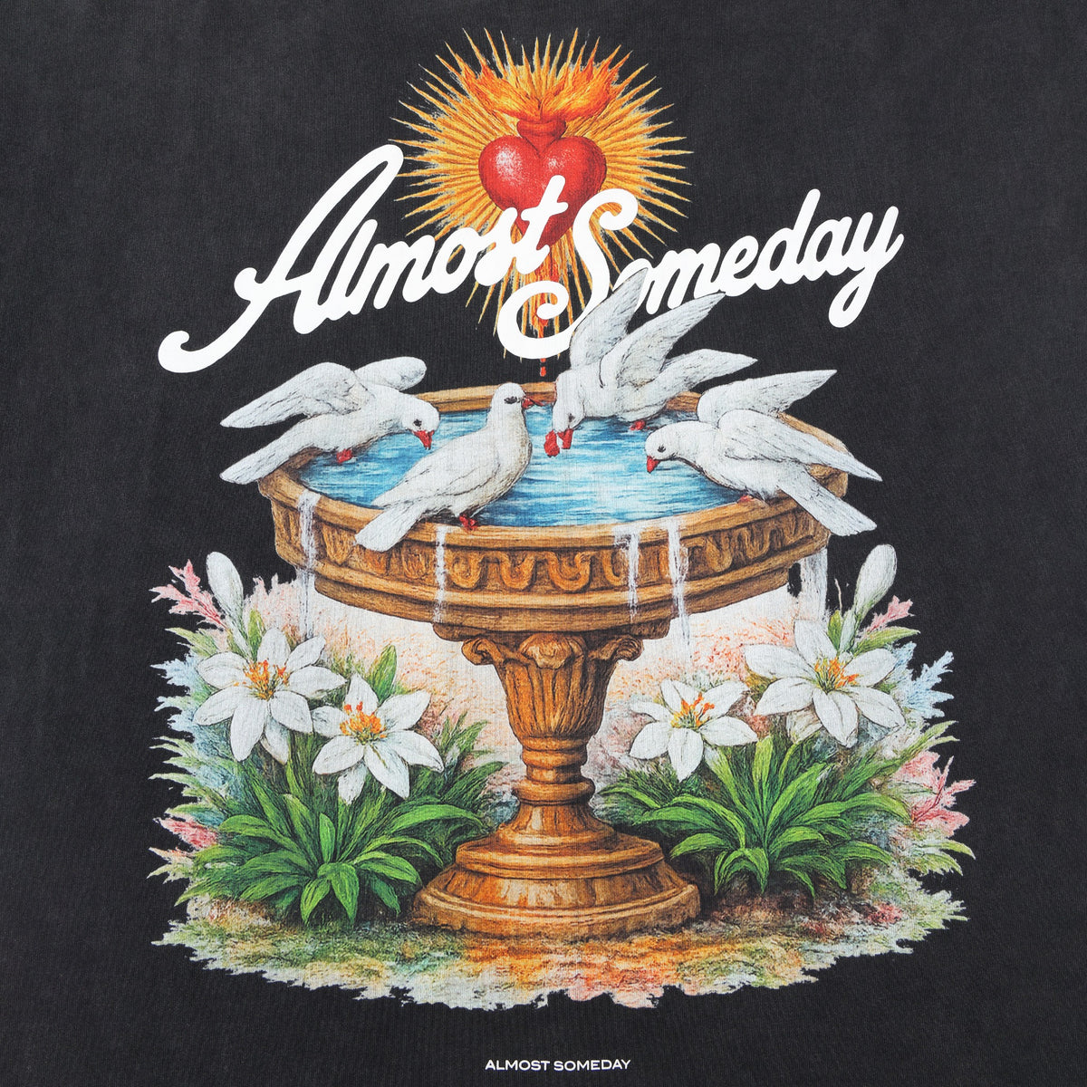 Fountain Tee – Black – Close-up of back artwork with golden fountain, white doves, flowers, and red heart